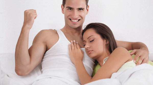 a woman in bed with a man who increased power